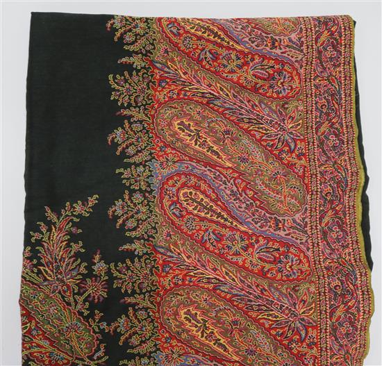 A 19th century paisley shawl with black central medallion